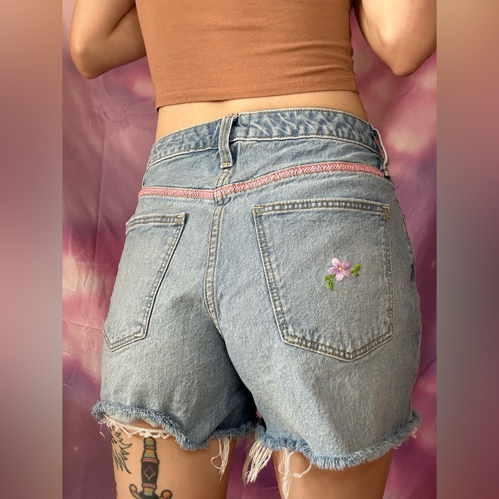 Hand embroidered distressed floral jean shorts